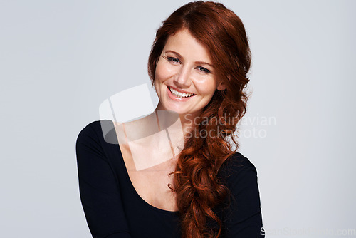 Image of Beauty, hairstyle and smile with portrait of woman for salon, hair care and cosmetology. Mockup, shampoo and female model isolated on white background for curly redhead haircut, makeup and cosmetics