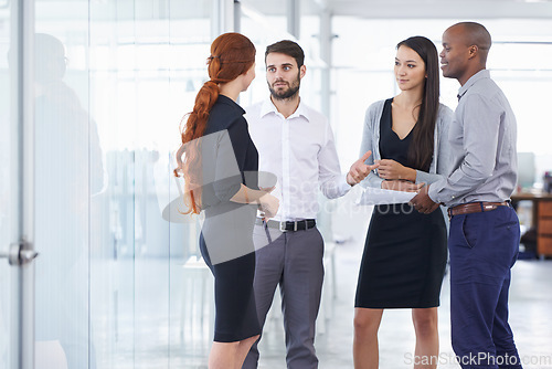 Image of Business people, team and discussion in office corridor with men, women or diversity for strategy at startup. Businessman, leader or talk for collaboration, teamwork or brainstorming for company goal