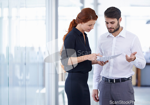 Image of Business people, documents and planning for corporate finance in meeting or teamwork at the office. Businessman and woman discussing paperwork in collaboration, financial management or company budget