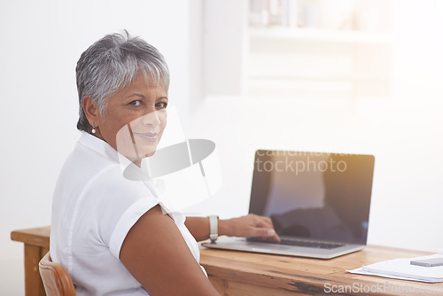 Image of Computer, portrait and senior woman in office smile for online management, digital project and planning or typing. Face of business person, professional worker or employee working at desk on laptop