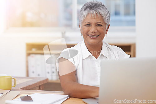 Image of Portrait, laptop and senior woman in office smile for career management, digital administration and planning. Happy face of biracial business person, manager or employee working at desk on computer