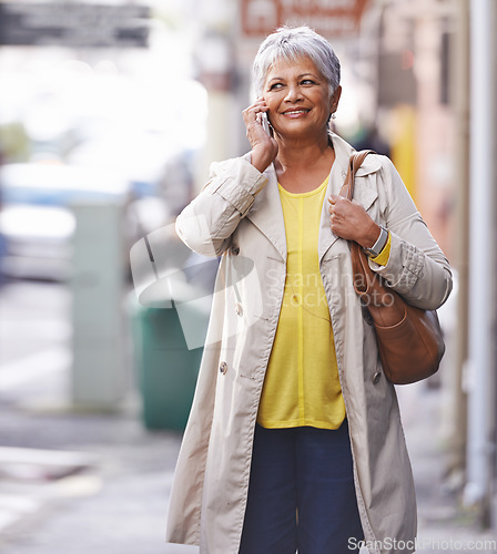 Image of Phone call, city walk and senior woman talking on cellphone discussion, communication or chat to smartphone user. Urban travel, connectivity and elderly person consulting, commuting or talk on mobile