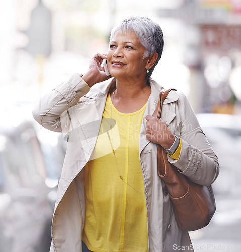 Image of Phone call, communication and senior woman walk, travel or on urban city commute while talking to cellphone contact. Discussion, conversation and elderly person consulting, speaking or chat on mobile