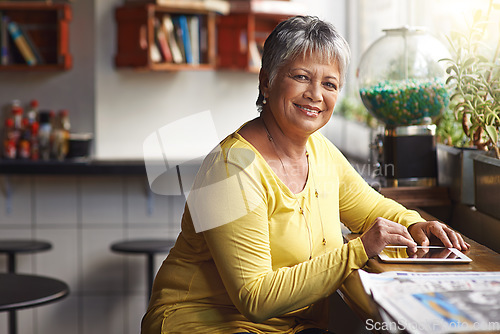 Image of Portrait, restaurant and senior woman with a tablet, connection and social media with happiness. Face, mature female person and lady with a smile, technology and online reading to relax in a cafe