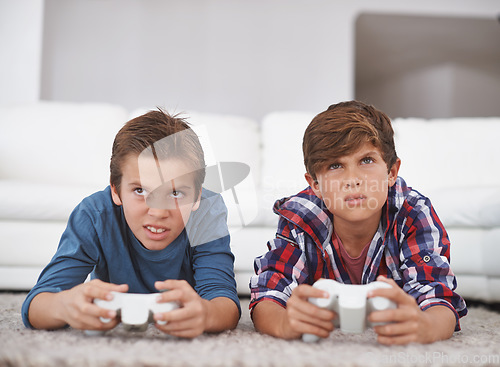 Image of Boys playing video game, friends and confused while gaming in challenge, competition and concentration. Gamer kids, doubt or console games at home, youth and male children with esports or controller