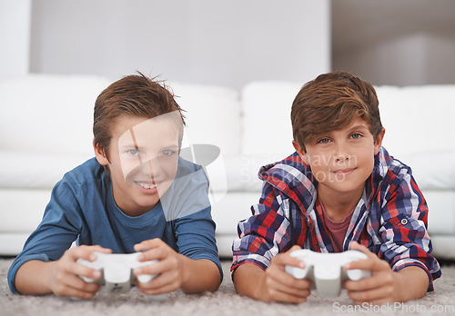 Image of Boys playing video game, friends and gaming at home in smile portrait for fun together in living room. Gamer kids play games on console, youth and happy male children with esports and controller