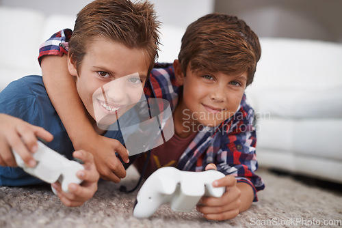 Image of Boys playing video game, friends in portrait and gaming with technology, esports and entertainment in living room. Gamer kids play games on console at home, youth and male children have fun together