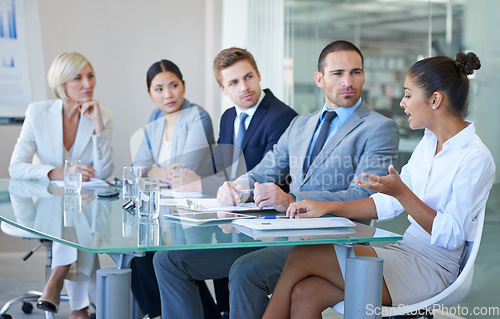 Image of Business people in a meeting, collaboration and planning in conference room with diversity in corporate group. Men, women and female team leader with conversation, project strategy and teamwork