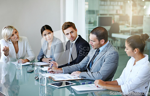 Image of Corporate group in business meeting, team discussion in conference room with diversity in workplace. Men, women and professional planning with conversation, collaboration and analytics paperwork