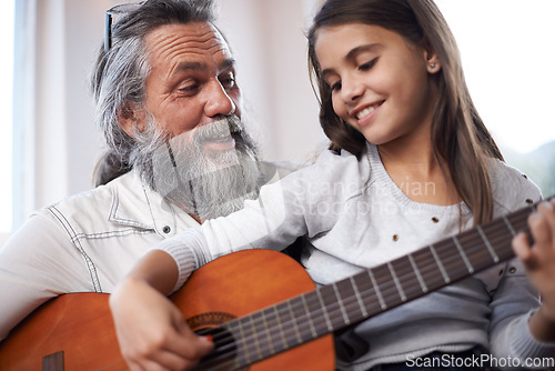 Image of Girl with grandfather, happy with guitar and learning to play, music education and creative development. Musician, art and old man helping female kid learn focus and skill on musical instrument