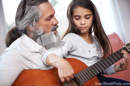 Image of Music, guitar and grandfather teaching girl to play, help with creativity, learning and creative development. Musician, senior man helping female kid learn focus and skill on musical instrument