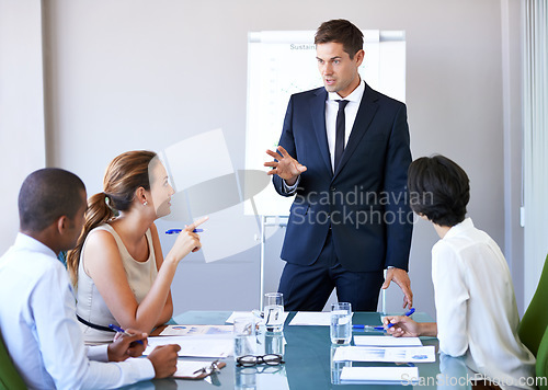 Image of Business man, workshop speaker and meeting of a corporate management team with financial data. Speaking, businessman and collaboration of accounting staff working in a conference room with strategy