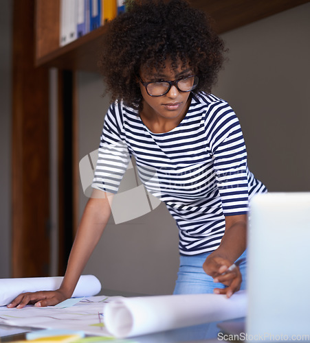 Image of Blueprint, focus and designer woman on laptop in digital planning, project brainstorming and focus. African person on floor plan or architecture documents for problem solving or solution on computer