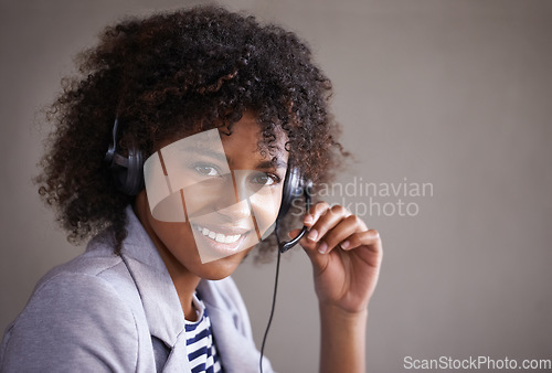 Image of Portrait, call center and happy woman in headset and virtual communication, technical support or talking online. Professional agent, consultant or face of African business person in telemarketing job