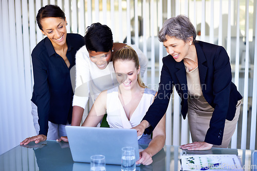 Image of Corporate, collaboration and women with a laptop, teamwork and share ideas at the workplace. Female professionals, employees and workers with happiness, staff and technology for startup development