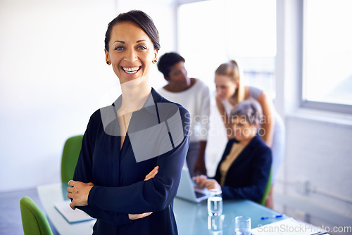 Image of Portrait, corporate and woman with arms crossed, happy and startup with management, teamwork or profit growth. Face, female leader or employee with staff, group or planning in the office and workshop