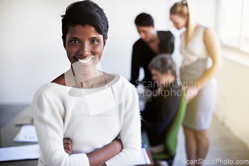 Image of Smile, leadership and portrait of a businesswoman in a meeting in a modern corporate office. Happy, success and professional Indian female manager standing with crossed arms in workplace boardroom.