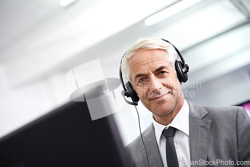 Image of Portrait, call center and senior man with telemarketing, consultation and communication with a headset. Face, male consultant and happy employee with headphones, tech support and friendly service