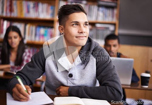 Image of Thinking, writing and college with man in library for education, research and classroom quiz. Focus, learning and notebook with male student on university campus for study, scholarship or idea