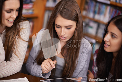 Image of University, school and women in library on tablet for online research, studying and group project. Education, college academy and female students on digital tech for knowledge, internet and learning