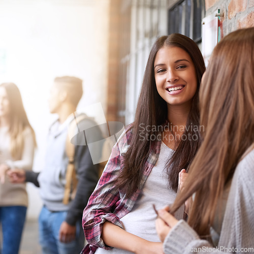 Image of Girl friends, university hallway and female talking with happiness and discussion together. Teenager, college girls and school communication of young and gen z students on campus for education