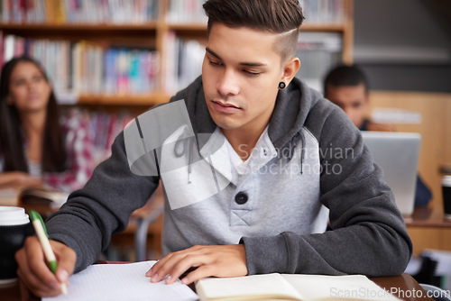 Image of Study, writing and college with man in classroom for education, library research and quiz. Focus, learning and notebook with male student on university campus for knowledge, scholarship and project