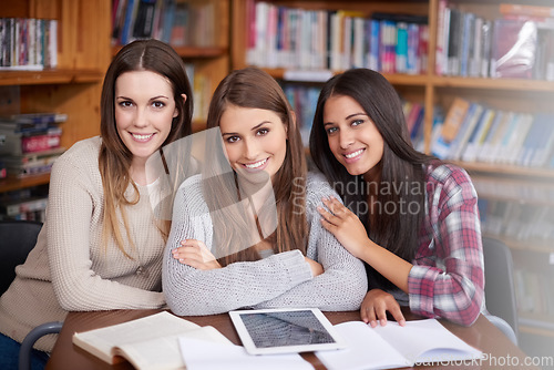 Image of University, education and portrait of women in library for online research, studying and group project. School, learning and happy female students on digital tech for knowledge, internet and website