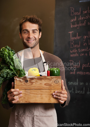 Image of Chef, vegetable crate and portrait of man in restaurant with vegetables for vegetarian or vegan ingredients. Smile, male cook with box and food from Canada for cooking in kitchen or small business.
