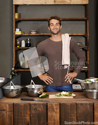 Image of Chef, man akimbo and portrait in kitchen while making delicious food for healthy diet and nutrition. Cooking, confidence and male cook standing in rustic restaurant or small business in Canada.