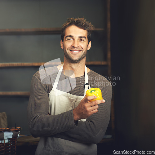 Image of Chef, bell pepper and portrait of man in kitchen with vegetables for vegetarian, healthy diet or vegan ingredients. Smile, male cook holding capsicum and food from Norway for cooking in restaurant.