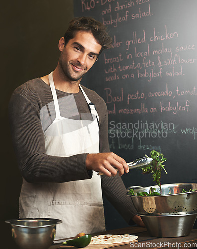 Image of Chef, man and portrait with salad in kitchen for delicious meal, healthy diet and nutrition. Cooking, vegetables and male cook preparing vegan food for fine dining in restaurant or small business.