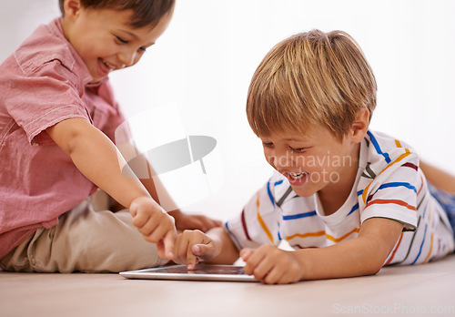 Image of Children, playing and tablet for learning and education in family home for happiness and fun. Male kids or friends together for play, laughing and streaming on internet for development with app video