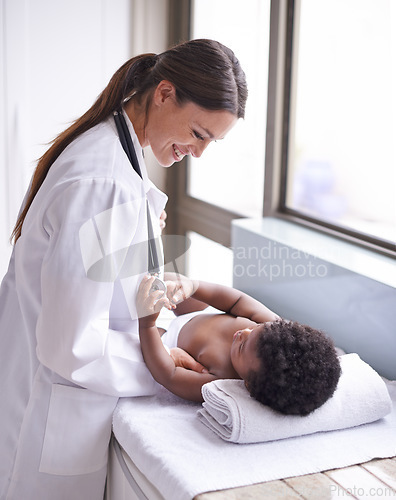 Image of Doctor woman with baby boy, healthcare and pediatrician consultation with health insurance and pediatric medicine. Female physician with smile, African and male toddler in medical checkup at clinic