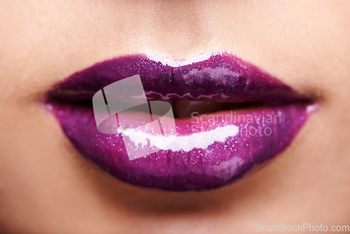 Image of Woman lips, purple lipstick and shine with makeup and beauty closeup, glossy cosmetics product and cosmetology. Glow, bold color aesthetic and cosmetic care, female model with violet lip gloss