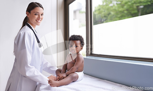 Image of Doctor woman with baby boy, pediatrics and health with early childhood development and growth. Female pediatrician portrait, African male toddler with medical checkup at clinic or hospital