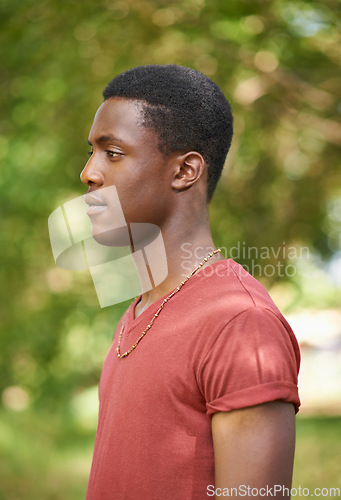 Image of Profile, teen boy and outside in garden with bokeh blurred background or African teenager, nature and forest, park or calm summer. Young male person, serious face and green, trees or spring sunshine