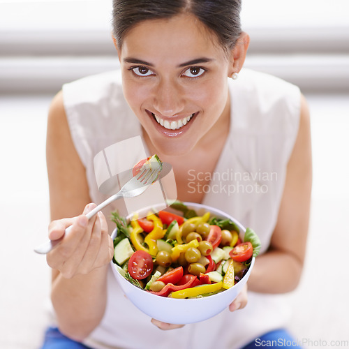 Image of Happy woman, portrait smile and salad for healthy diet, food or nutrition eating at home. Female vegan with bowl, fork or vegetables smiling in happiness for natural health, lose weight or wellness