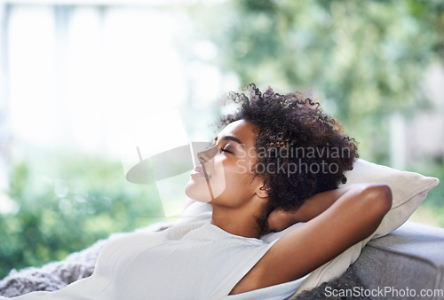 Image of Relax, smile and black woman on sofa sleeping, afternoon nap and rest in calm apartment on weekend. Sleep, daydream ideas and girl on couch relaxing, self care and stress free chill time in lounge.