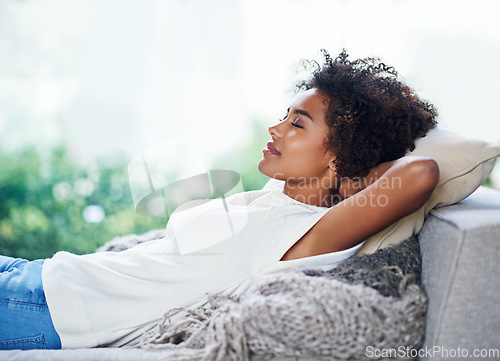 Image of Relax, sleep and woman on sofa in living room, afternoon nap and calm weekend rest in apartment. Sleeping, daydream and peace, girl on couch relaxing, self care and stress free chill time in lounge.