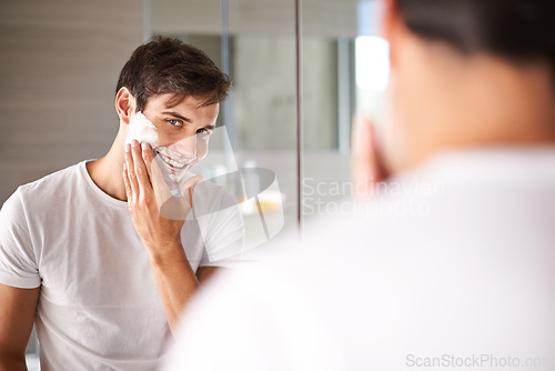 Image of Mirror, shaving and portrait of man in bathroom for facial grooming, wellness and beauty at home. Health, skincare and happy male person with shave foam for face hygiene, cleaning and hair removal