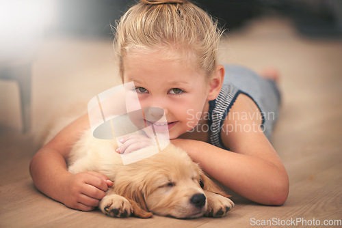 Image of Girl hug her puppy in portrait, relax at home and happy with sleeping golden retriever and child with smile. Happiness, pet care and love with female kid with her domestic animal lying on wood floor