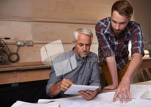 Image of Architect men, teamwork and planning with tablet, discussion and digital analysis of blueprint in workshop. Senior man, young partner and touchscreen for building, property or real estate development