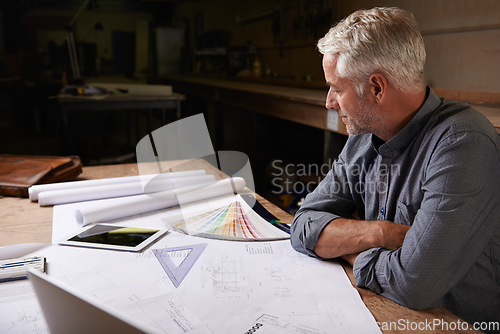 Image of Man, senior architect and blueprint drawing in workshop, professional designer and engineering. Architecture design, floor plan paperwork on table with designing equipment and creative male engineer