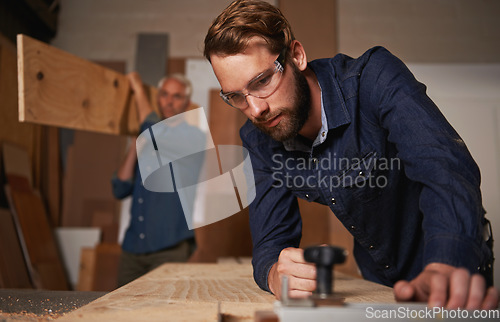 Image of Carpentry collaboration, carpenter and men work in workshop on design project with vocation and creative skill. Teamwork, male worker cutting wood with power tools and father and son working together