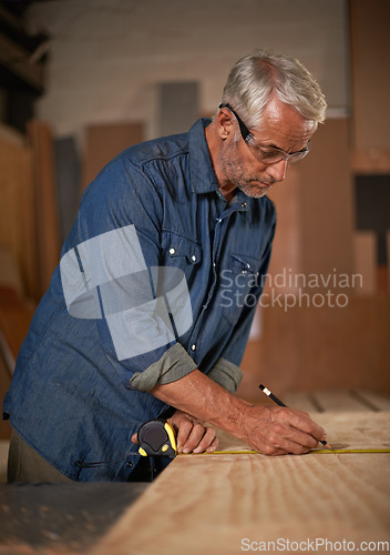 Image of Carpentry, measuring tape and man with pencil, wood and designer furniture manufacturing workshop. Creativity, small business and professional carpenter working on sustainable wooden project design.