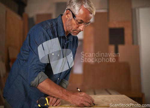 Image of Carpenter, measuring tape and man with pencil, safety glasses and designer furniture manufacturing workshop. Creativity, small business and professional man planning sustainable wood project design.