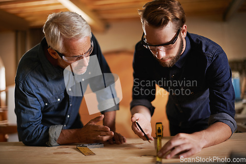 Image of Carpentry, men and measurement in workshop teaching and learning furniture design, manufacturing or internship. Mentorship, carpenter or apprentice at sustainable wood business or teamwork on project