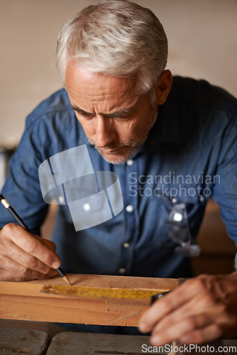 Image of Carpentry, wood and man with pencil, focus and thinking at designer furniture manufacturing workshop. Creativity, small business and professional carpenter working on design for sustainable project.