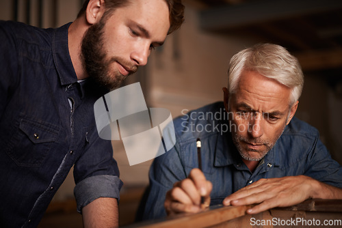 Image of Training, learning and carpenter with apprentice, helping with woodwork in professional furniture manufacturing workshop. Expert mentorship, carpentry and teamwork for men at sustainable business.