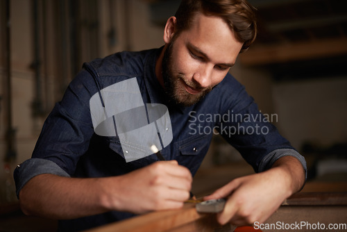 Image of Carpentry, measurement and happy man with pencil, wood and designer furniture manufacturing workshop. Creativity, small business and smile, expert carpenter working on sustainable project design.